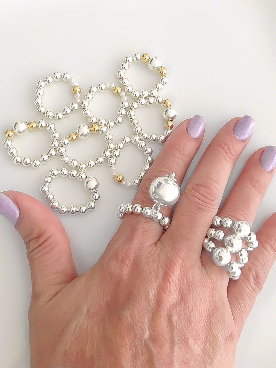 Silver and two tones ball elastic rings each